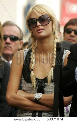 Paris Hilton at the Ceremony Honoring Los Angeles Lakers Owner Jerry Buss with the 2,323rd star on the Hollywood Walk of Fame. Hollywood Boulevard, Hollywood, CA. 10-30-06