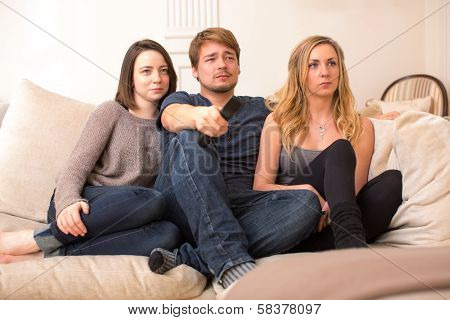 Three Teenage Students Watching Television