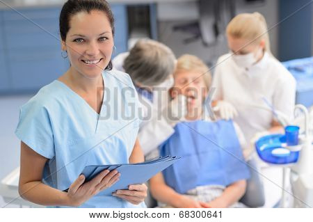 Professional dentist  team checkup teenage patient boy at dental surgery