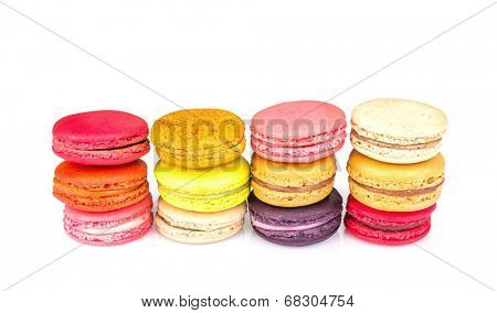 French colorful macarons on white background
