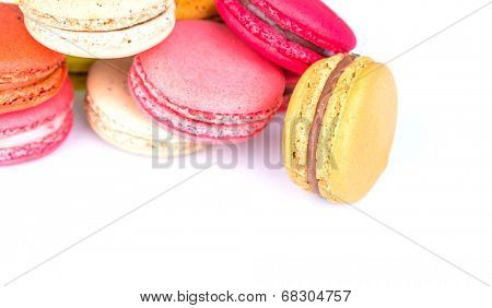 French colorful macarons on white background