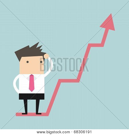 Businessman on growing graph
