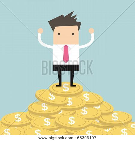 Businessman standing on gold coin