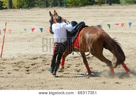 LYTKARINO, MOSCOW REGION, RUSSIA - JULY 12, 2014: Sergey Murugov performs stunts during Russian championship in trick riding. Lytkarino housed the Russian Federation of trick riding