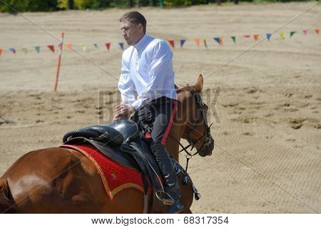 LYTKARINO, MOSCOW REGION, RUSSIA - JULY 12, 2014: Sergey Murugov performs stunts during Russian championship in trick riding. Lytkarino housed the Russian Federation of trick riding