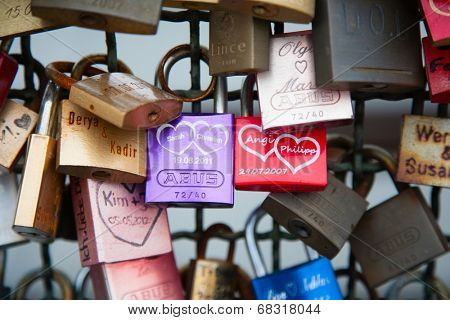 COLOGNE, GERMANY - MAY 29, 2014, Thousands of love locks which sweethearts lock to the Hohenzollern Bridge to symbolize their love on May 29 in Koln, Germany 