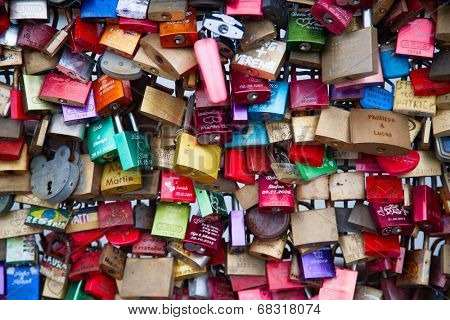 COLOGNE, GERMANY - MAY 29, 2014, Thousands of love locks which sweethearts lock to the Hohenzollern Bridge to symbolize their love on May 29 in Koln, Germany 