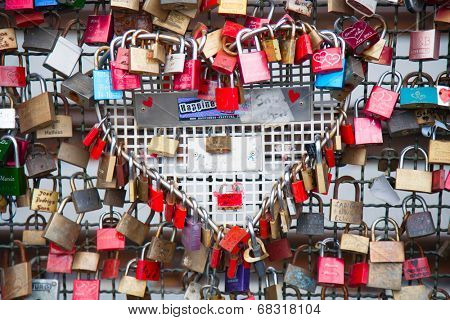 COLOGNE, GERMANY - MAY 29, 2014, Thousands of love locks which sweethearts lock to the Hohenzollern Bridge to symbolize their love on May 29 in Koln, Germany 