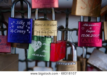 COLOGNE, GERMANY - MAY 29, 2014, Thousands of love locks which sweethearts lock to the Hohenzollern Bridge to symbolize their love on May 29 in Koln, Germany 