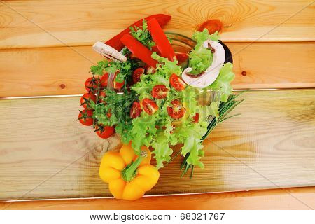 image of vegetables in salad on wood