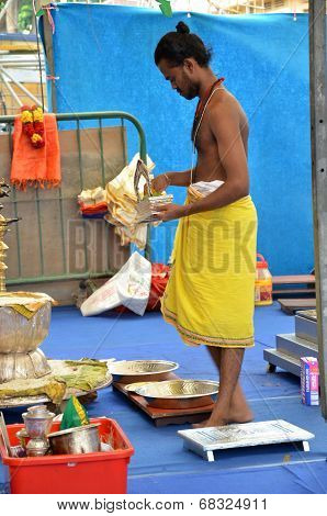 Male Hindu Prepares For Dinner In The Sri Srinivasa Perumal Temple