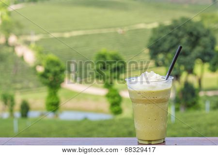 Ice Green Tea Smoothies On Tea Plantation Blackground