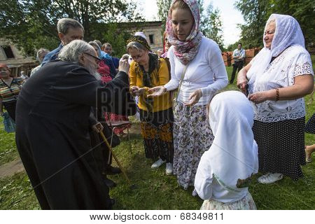 KRASNY BRONEVIK, RUSSIA - JULY 7, 2014: Celebrations commemorating the Rev. Anthony Dymsky (died 1224) in Antony Dymsky Monastery - Procession on Lake Dymsky, the great blessing of water and bathing.