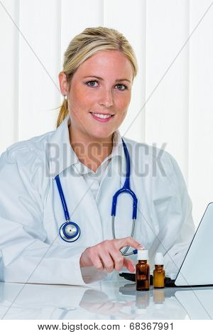 portrait of a young, sympathetic female doctor in their doctor's office. smile bestows confidence.