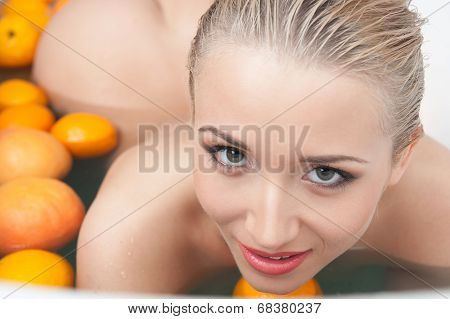 Top view portrait of sexual young blonde nude woman relaxing in