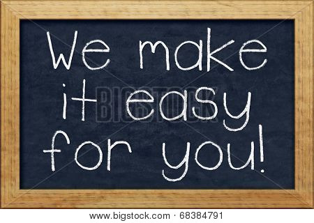 A nice black chalkboard with text we make it easy for you
