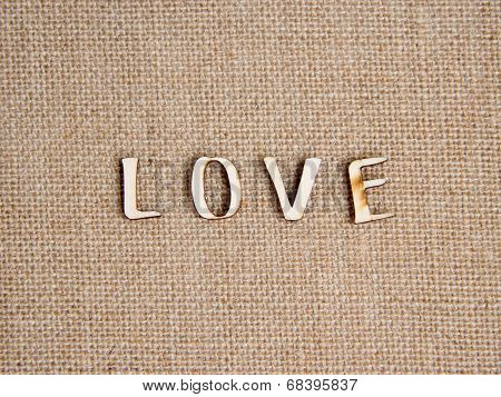 Word love on burlap