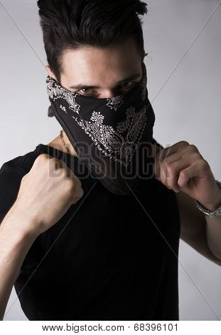 Man In A Bandanna Balling His Fists Aggressively