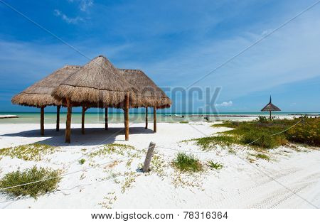 Umbrellas on stunning tropical beach at Holbox Mexico