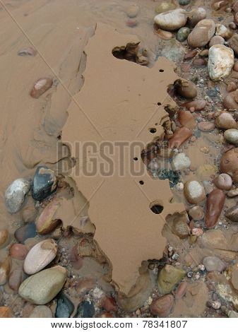 Beach Stones And Sand Erosion
