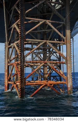 Underneath Jack Up Drilling Rig In The Ocean - Oil And Gas Industry