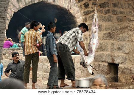 :Hindu devotees make animal sacrifice during Bonalu festival to prepare bonam as offering to goddess