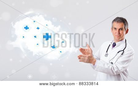 Proffesional doctor listening to abstract cloud with medical signs