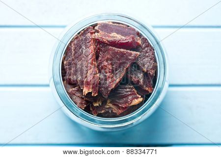 beef jerky in jar on kitchen table