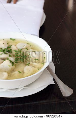 Broth with dumplings.