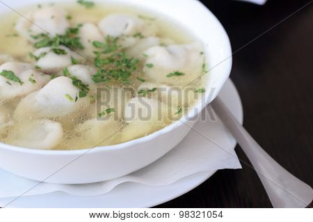Broth with dumplings.