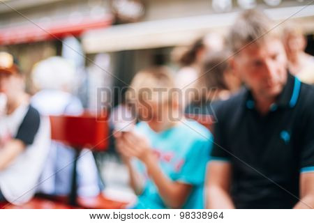 Blurred Colorful Bokeh Background With Unrecognisable People