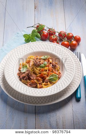 tagliolini with squid and fresh tomatoes