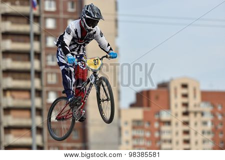 ST. PETERSBURG, RUSSIA - AUGUST 6, 2015: Unidentified biker in the BMX race Cruiser. The competitions is a stage of the BMX racing championship of Russia
