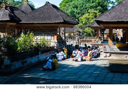 People praying in Turta Empul temple in Bali, Indonesia.