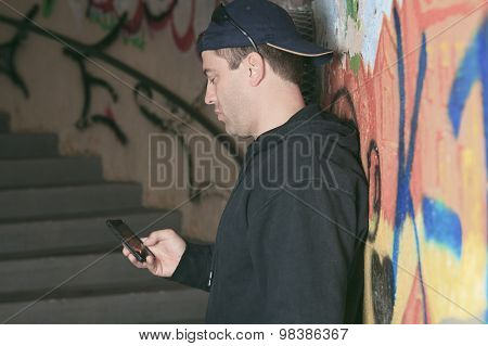 Drug dealer in a tunnel. A dark place to deal person.