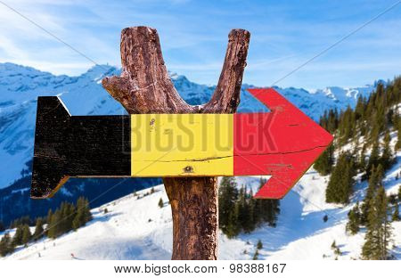Belgium Flag wooden sign with winter background