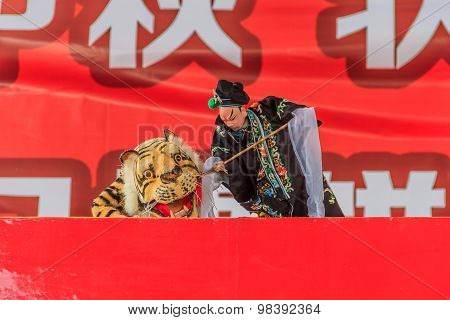 Chinese puppeteer performing a hand puppet show