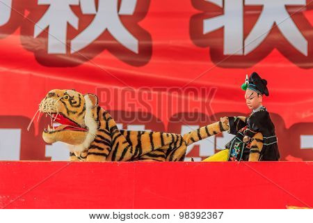 Chinese puppeteer performing a hand puppet show