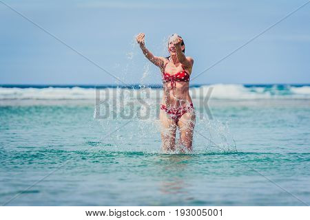 Woman Enjoying The Sea And Waves Of Atlantic Ocean.