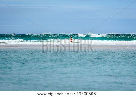 Woman Enjoying The Sea And Waves Of Atlantic Ocean.