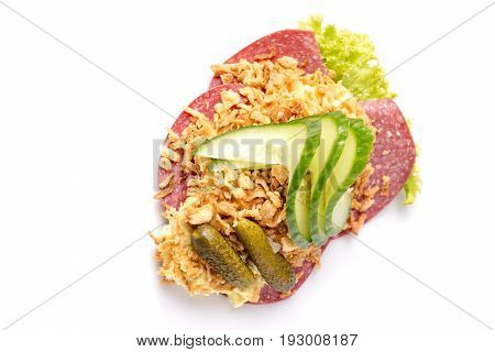 Danish specialties and national dishes high-quality open sandwich Salami with crispy fried onion remoulade and cucumber isolated on white background