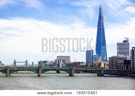 LONDON - APR 20 : The Shard building and riverside pictured on April 20th, 2013, in London. The Shard opened to the public on February 2013. Standing 309m, the Shard is the tallest building in Europe.