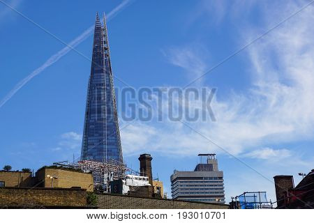 LONDON - APR 20 : The Shard building and riverside pictured on April 20th, 2013, in London. The Shard opened to the public on February 2013. Standing 309m, the Shard is the tallest building in Europe.