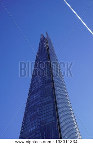 LONDON - APR 20 : The Shard building and riverside pictured on April 20th, 2013, in London. The Shard opened to the public on February 2013. Standing 309m, the Shard is the tallest building in Europe.