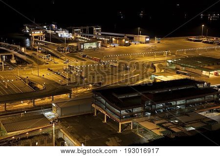 Dover/England - June 11 2011:Last Ferries leaving Dover at night. A view of the Dover port terminal from the White Cliffs