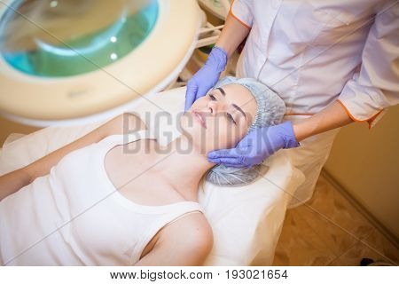 Cosmetology Doctor Makes Woman Treatments Facial Massage 1