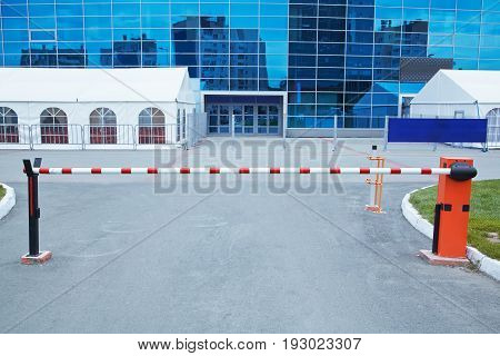 horizontal security barrier at the entrance to the car park