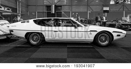MAASTRICHT NETHERLANDS - JANUARY 15 2016: Grand tourer coupe Lamborghini Espada Series II 1972. Black and white. International Exhibition InterClassics & Topmobiel 2016
