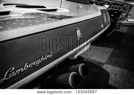 MAASTRICHT NETHERLANDS - JANUARY 15 2016: Fragment of a high-performance mid-engined sports car Lamborghini Diablo VT 6.0 2000. Black and white. International Exhibition InterClassics & Topmobiel 2016