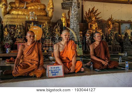 PHUKET THAILAND JUNE 3 2017:Newly ordained Buddhist monk pray with priest procession.Thai monk ritual for change man to monk in ordination ceremony in buddhist in Thailand
